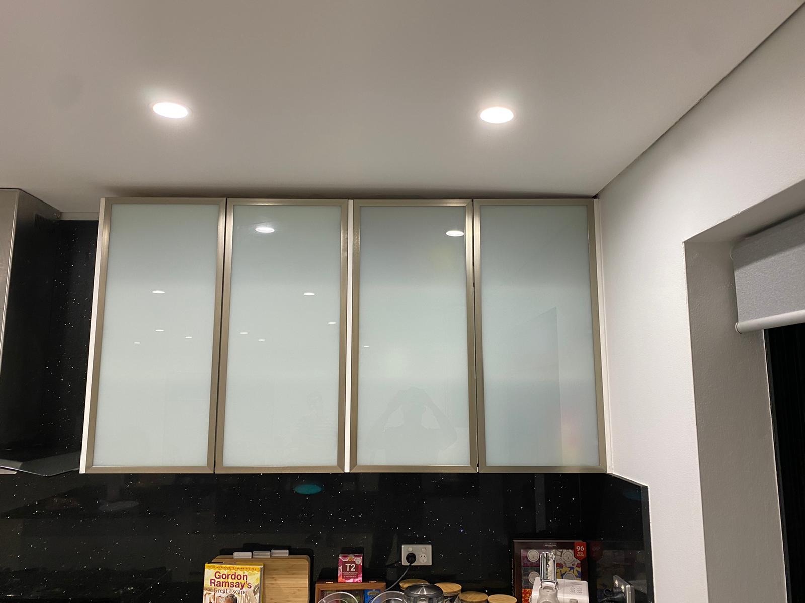 Custom kitchen cabinetry with frosted glass doors and LED lighting – Diagrid Constructions